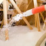 Blow-in insulation being installed in attic in Kalispell Montana home